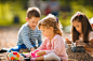Little girl playing with her friends at the outdoor playground._创意图片