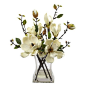 Magnolia Arrangement w/Vase A simple, yet elegant artificial plant that adds a delicate touch to any environment. The serene white flowers create a sense of harmony with its multiple stemmed displays, and are further accented by the gentle greenery housed