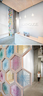 19 Ideas For Using Hexagons In Interior Design And Architecture // A 17 foot tall screen made from birchwood hexagons woven with colorful twine greets you as you enter the FloatHouse in Vancouver.: 