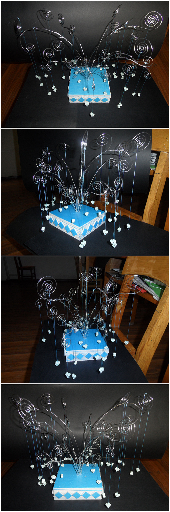 kt板做的底座树枝是用细铁丝折出来的下面吊的小东东是用纸做的立体的