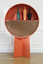 Patricia Urquiola's Luna cabinet conceals items behind pivoting doors.