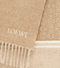 A wool scarf is an essential accessory for the colder months, allowing you to keep warm while expressing your personal style. This iteration from LOEWE features delicate fringing and an embroidered brand name, with a subtly repeated Anagram in block fashi