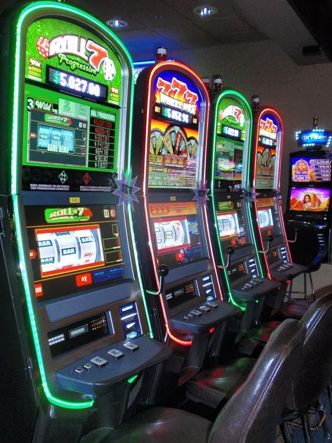 several slot machines lined up next to each other in a casino room with ...