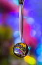 Magic from faucet : I took this water drop just flowing from the faucet, I put the shining paper in the background, and used flash.
I wanted a faster shutter speed, but my kitchen doesn't have enough lights, so 1/8 was the best, I have over 100 pics that 