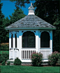 Victorian Garden House Gazebo - This single tiered Victorian garden house features window screen inserts and screened front door. Pictured with optional white stain. Shipped kit. Motor freight.: 