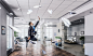 Jumping businessman in office. Funny jumping businessman in modern 3D rendering interior. Mixed media_创意图片