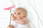Baby girl holding a flower by Michiko Tierney on 500px