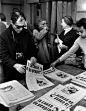 Jean-Luc Godard, Jean-Paul Sartre, and Simone de Beauvoir gather to distribute copies of the Maoist newspaper La Cause du Peuple on the street after it is banned by the government (Paris, 1970).