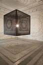 Intersections: An Ornately Carved Wood Cube Projects Shadows onto Gallery Walls wood shadows religion light Islam installation