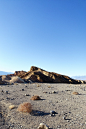 brown rocky mountain under blue sky during daytime