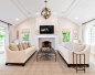 Living room - large transitional formal and enclosed light wood floor and beige floor living room idea in Milwaukee with a standard fireplace, a wall-mounted tv, beige walls and a brick fireplace