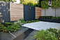 Modern Courtyard Garden Design London Cat Howard Garden Builders Anewgarden   Copper garden lights, grey render raised bed walls, granite sawn grey sand stone and basalt paving hardwood slatted screen fence trellis, lush green low maintenance planting Ane