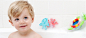baby in a tub with Nuby Bathtime toys 