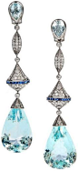 Aquamarine, diamond, sapphire, and platinum long dangle earrings. That's 50 carats of aquamarines right there, with 2.50 carats of diamonds. They're made in classic Art Deco style, but they're contemporary. Via Diamonds in the Library.