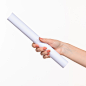 white-cylinder-props-female-hands-white_155003-24979
