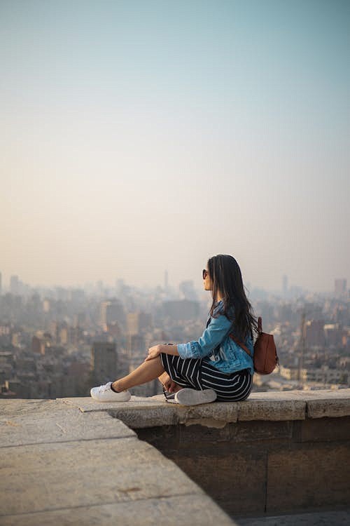 Woman Sitting on Top...