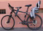 Cool Bike Hack – Guy turned bike into triple transporter with a safe child seat.
