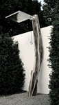 outdoor shower made with tree trunk