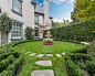 PALATIAL : This French styled estate features a grand circular pool with a collection of fountains and spray jets that create a large fountain effect. The pool is surrounded by an expansive stone terrace to