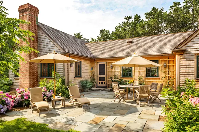 Beach style courtyard patio photo in Boston with no cover