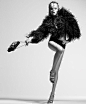Great fashion shot. Model has movement and lengthening in her pose. Studio shoot, black and white, fashion photography.: 