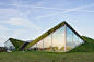studio marco vermeulen tops renovated biesbosch museum with a grass roof