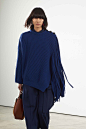 Image may contain Clothing Apparel Bag Handbag Accessories Accessory Cloak Fashion Poncho Sleeve Human and Person