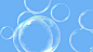 Blowing Bubbles : This is two 1080p motion graphic videos of soap bubbles being blown into the air outside on a summer day. The bubbles gradually move up and around the frame moving with the wind. One of the video styles starts our without any bubbles and