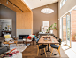 Contemporary open plan dining room in San Francisco with brown walls and medium hardwood flooring.