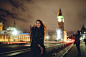 Young woman waiting for a taxi in London at night