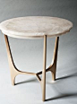 Athena side table with a rock crystal top resting on a cast bronzed base