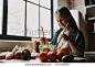 Portrait of Cute Child Daughter Preparing Salad. Happy Family in the Kitchen. Healthy Food at Home. Girl Cutting Vegetables and Smiling while Cooking Salad in Kitchen at Home.