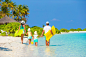 Family vacation. Happy beautiful family on a beach during summer vacation by Dmitry Travnikov on 500px