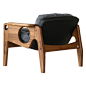 One of the last pieces Sergio Rodrigues designed, in 2013, the joyous "Tete" armchair boasts Rodrigues' signature circle cutouts, and is made from solid Brazilian native Freijó wood and fabric and leather upholstery.