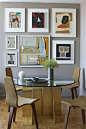 The brass, walnut, and ochre finishes mirror the paintings‘ palettes and bring warmth to the cool gray walls | archdigest.com: 