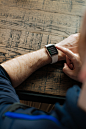 A man showing off his apple watch and the digital display on the watch screen
