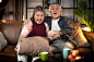 Old retired age asian couple watching tv at homeold mature asian couple cheering sport games competition together with laugh smile victory on sofa couch at living room home isolation activity