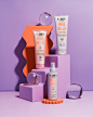 其中包括：purple and orange aesthetic, using wiggle and wavey props for UK haircare brand Noughty for their curly hair range - wave hello. photographed and styled by Gemma Wood photography