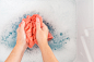 Female hands washing color clothes in sink by Maria Kraynova on 500px