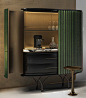 an open cabinet with a coffee maker on top and other items in the back ground