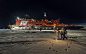 A group of torch bearers hold the Olympic torch at the North Pole, Arctic Ocean, on October 19, 2013. The nuclear-powered icebreaker 50 Let Pobedy (50 Years of the Victory) is in the background.?(AP Photo/Sergei Dolya)