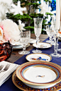 Elegant crystal glasses and chic colorful Hermes plates