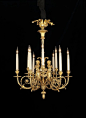 A Small Antique Gilt-Bronze Louis XVI Style Nine-Light Cherub Chandelier, after a model by Pierre Gouthière.  French, Circa 1880.