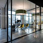 Glass-walled private office space at Biotronik in NYC | design by Ted Moudis…: