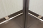 CabForms 2000-N Elevator Interiors with upper panels in ViviGraphix Graphica glass, Seagrass interlayer, Standard finish; lower panels in Stainless Steel, Marquisette finish; stiles and rails in Stainless Steel, Sandstone finish; Quadrant handrails at Wal