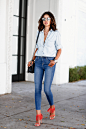 Annabelle Fleur doubles a light denim shirt with a pair of mid-blue high-waisted denims. Her orange fringed sandals bring a modern and sexy twist to this outfit.
Margot high-rise skinny jeans: L’Agence, Lovefringe suede sandals: Stuart Weitzman,...