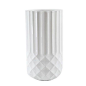 a white vase with geometric design on the bottom is shown in front of a white background