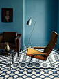 modern, blue living room with patterned tile floor