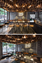 This contemporary restaurant has an artistic ceiling detail made from hundreds of wood veneer sheets.: 