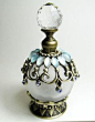 This contains an image of: Antique perfume bottles